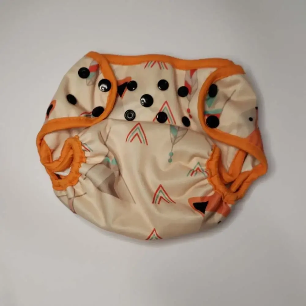 Adjustable Orange-Trim Diaper Cover with Geometric Feather Print